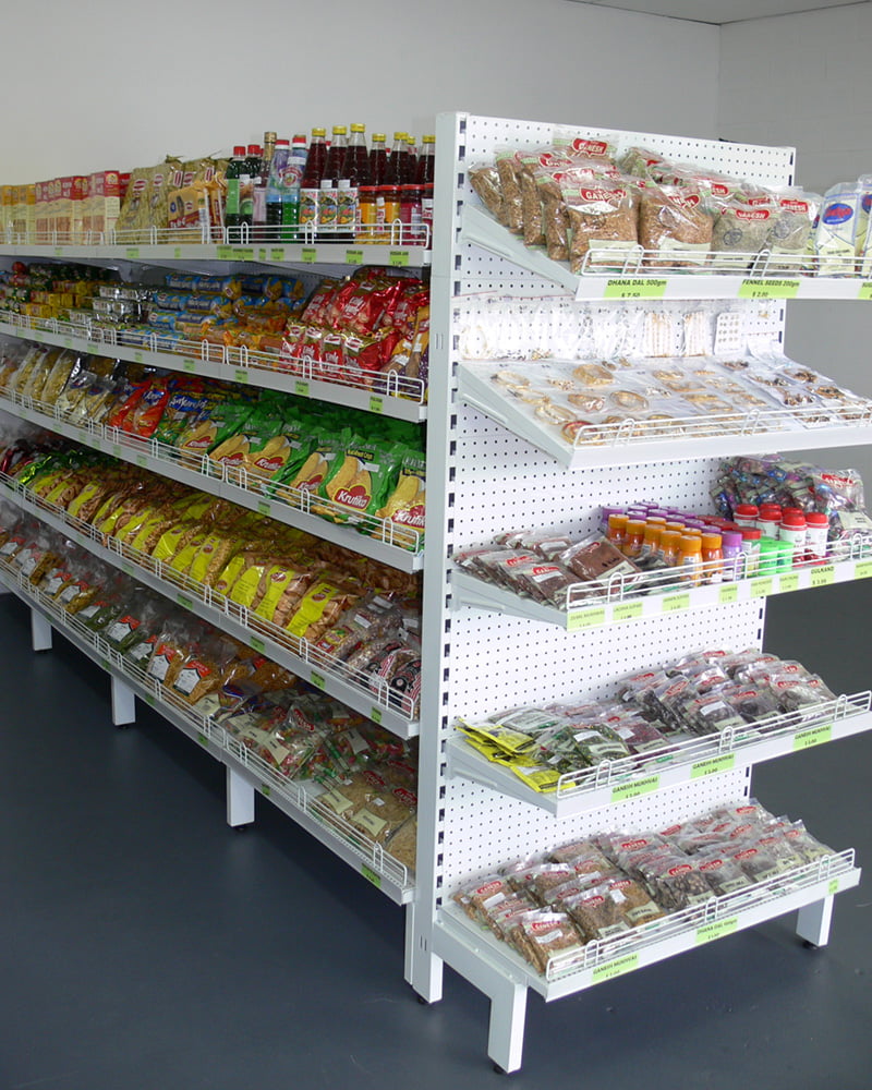 Supermarket Gondola shelving with packets of food